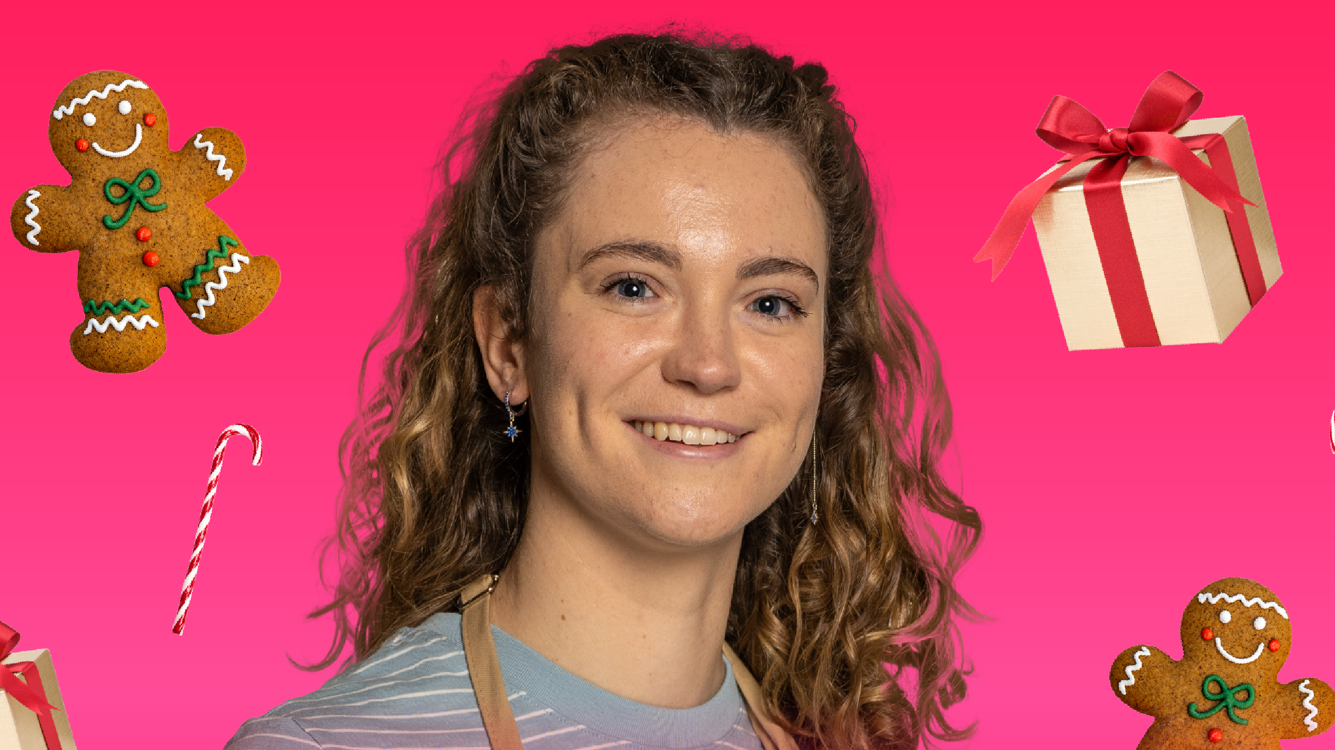 Photo of Tasha with Christmas items around her and in front of a pink background