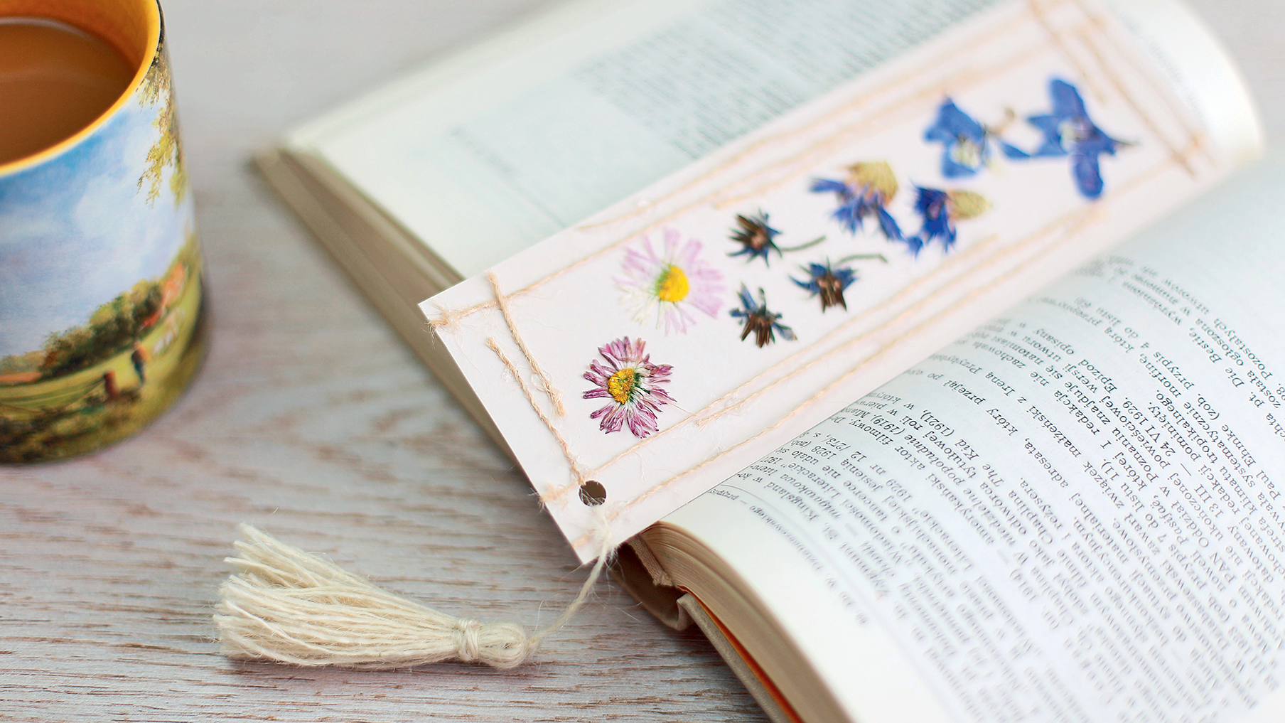 A flower bookmark between a book
