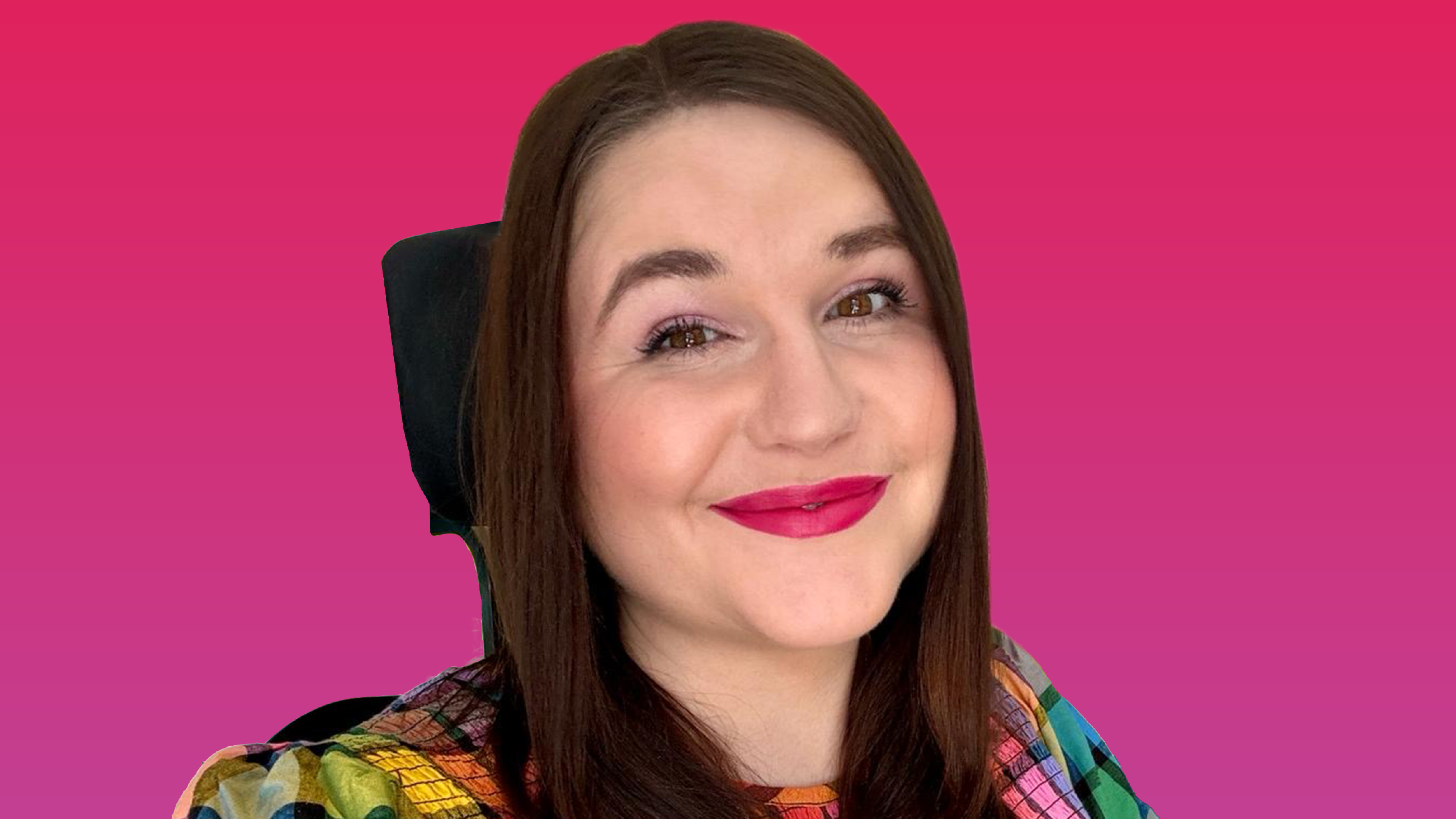 Photo of Sophie Bradbury-Cox wearing pink lipstick and smiling at the camera