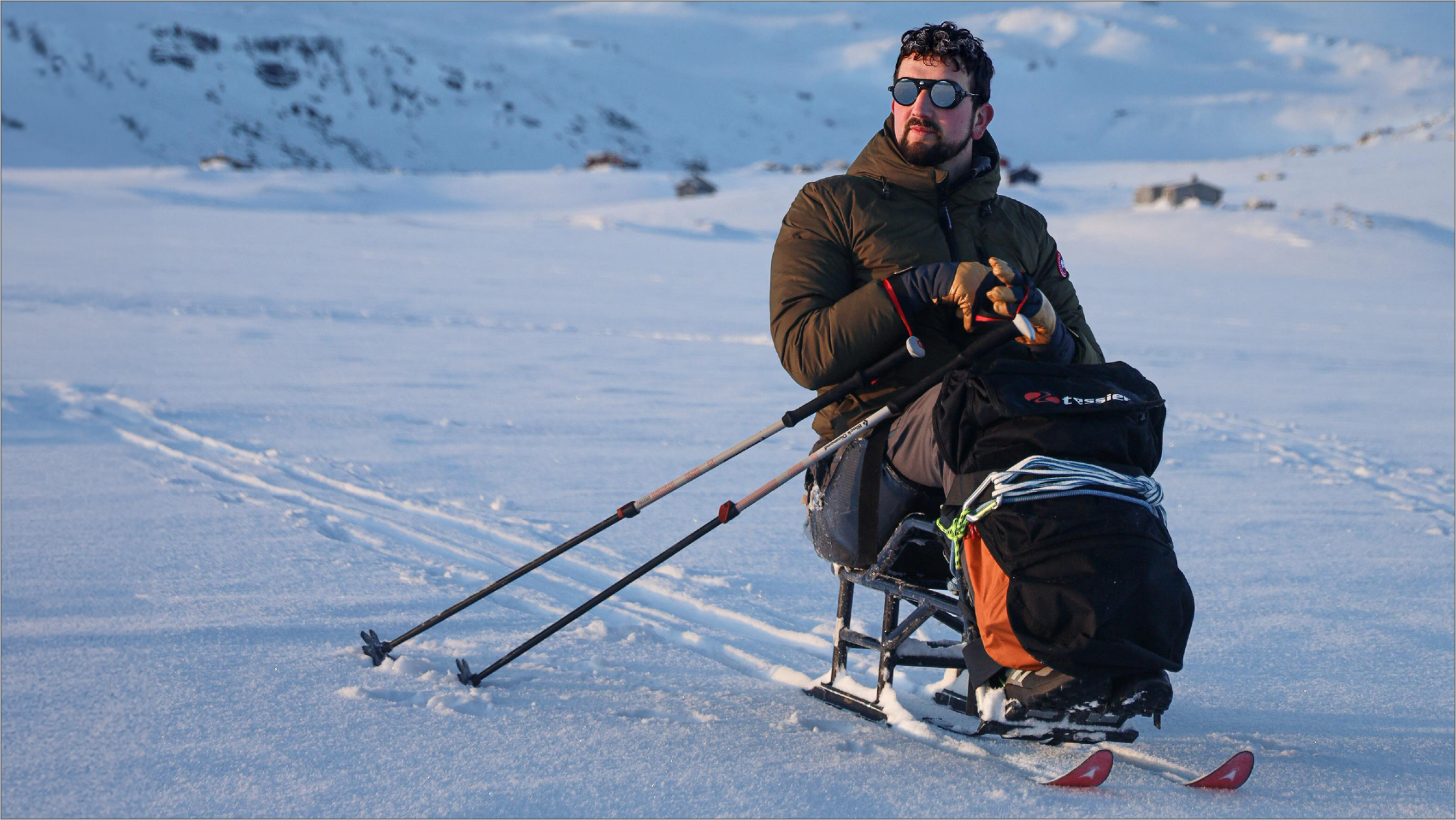 Photo of Darren Edwards sit-skiing in the Antartica 